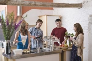 Friends together in kitchen