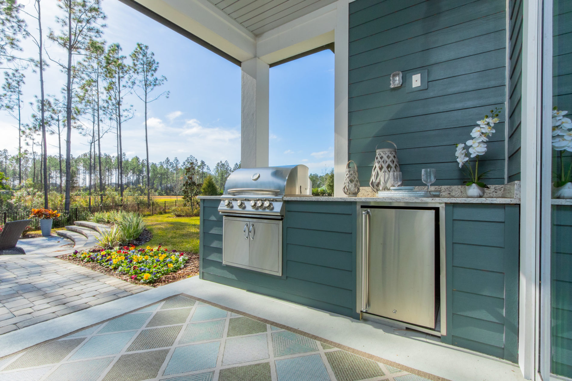 outdoor kitchen with blue siding jacksonville