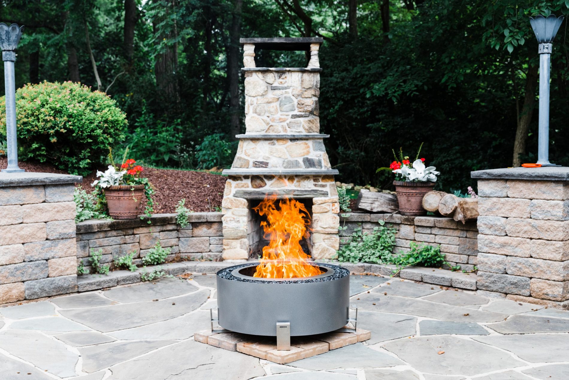 Should I get a fire pit or an outdoor fireplace? Read on to learn more about the best options for your outdoor living space?